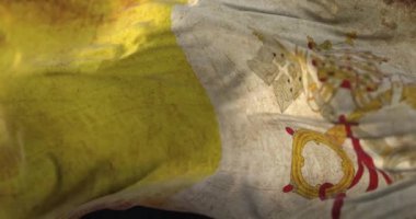 Old Vatican City Flag waving at wind. Loop