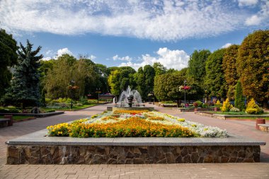 Summer park in the city of Khmelnytskyi. Square with a fountain.