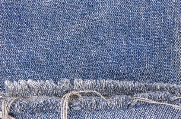 Texturou modré džíny — Stock fotografie