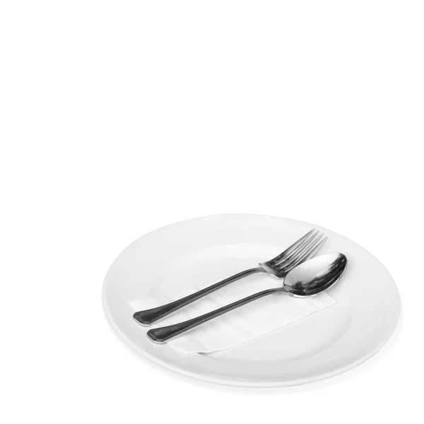 Spoon and a white plate — Stock Photo, Image