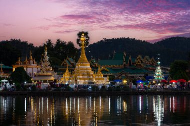 Viewpoint of Wat Phra That Chong Klang in the evening, beautiful market in front of the temple, Mae Hong Son, Thailand. Phra That Chong Klang temple