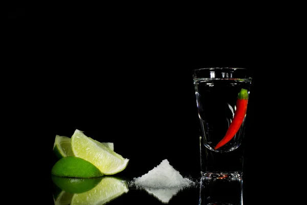 Tequila with chili on black background — Stock Photo, Image