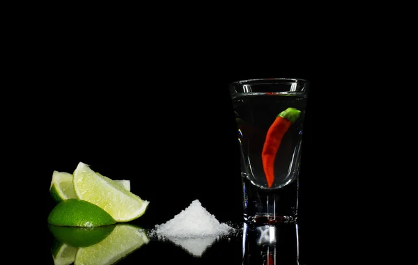 Tequila with chili on black background — Stock Photo, Image