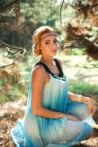 Portrait of beautiful girl in pine wood — Stock Photo, Image