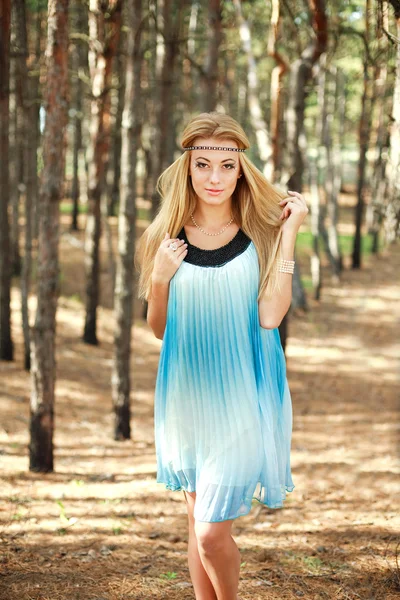 Portrait of beautiful happy girl in pine wood — Stock Photo, Image