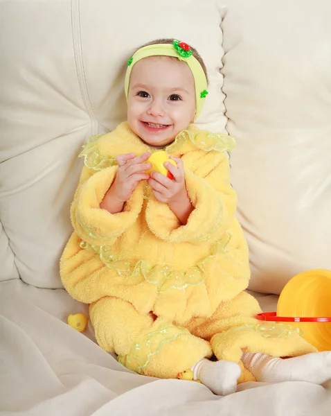 Baby infant in the studio, on a sofa — Stock Photo, Image