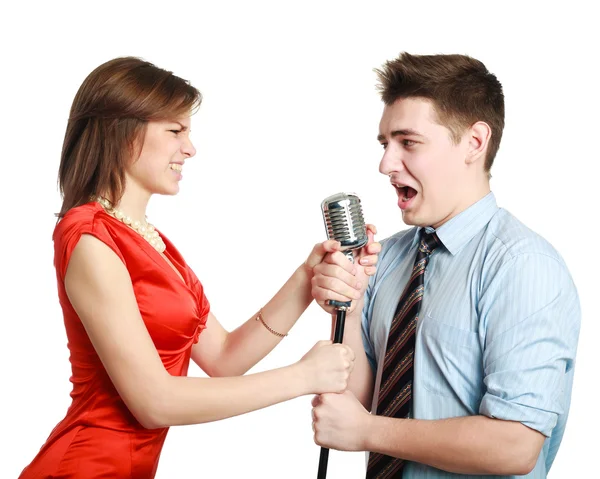 Young guy singing to a pretty girl, studio, isolated on white — Stock Photo, Image