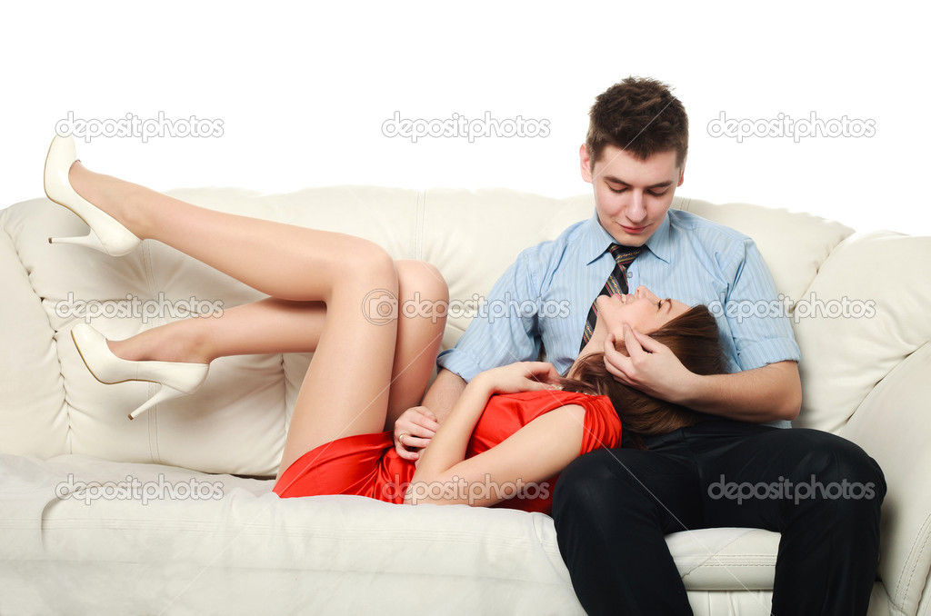 Emotional relationship, a young couple on the sofa, studio