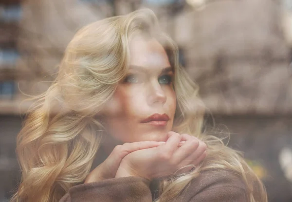 Beautiful Elegant Woman Brown Coat Sits Thoughtfully Window Glass Reflections — Stock fotografie