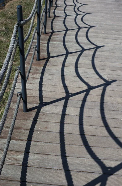 Der Schatten Des Seils Die Zäune Auf Dem Boden — Stockfoto