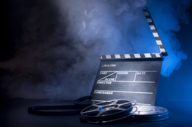 movie clapper and film reels clipart