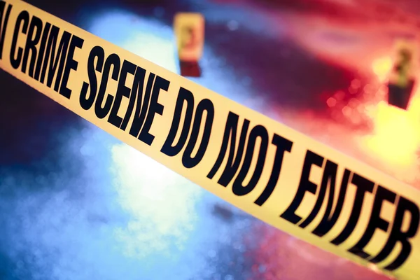 Fresh crime scene with yellow tape at night — Stock Photo, Image