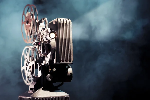 Old film projector with dramatic lighting — Stock Photo, Image