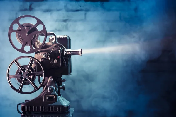 Old film projector with dramatic lighting — Stock Photo, Image