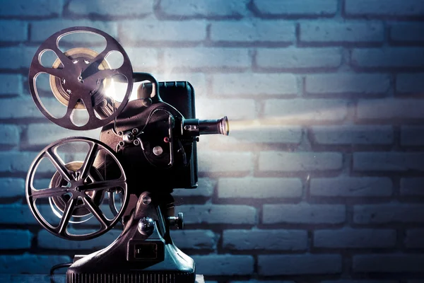 Old film projector with dramatic lighting — Stock Photo, Image