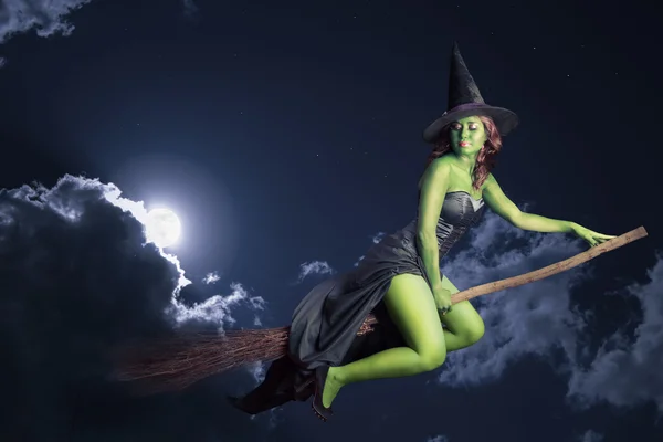 Halloween witch flying on broomstick — Stock Photo, Image