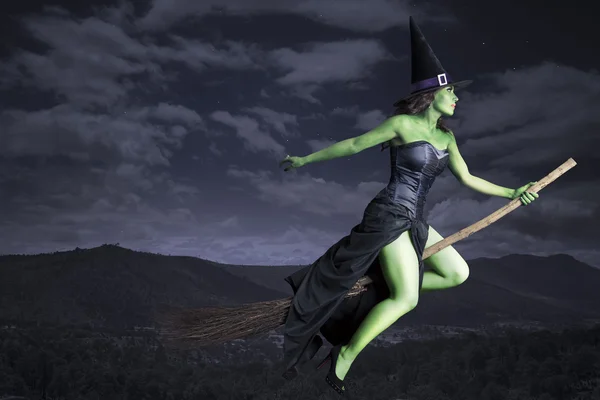 Halloween witch flying on broomstick — Stock Photo, Image