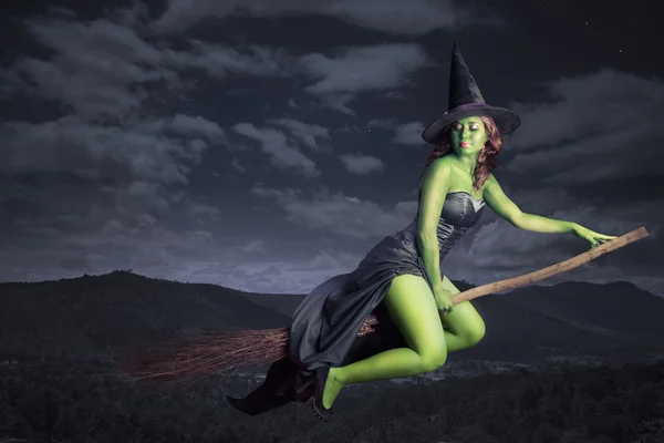 Halloween witch flying on broomstick — Stock Photo, Image