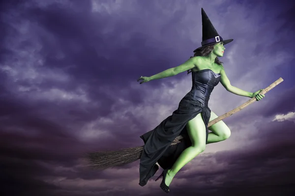 Halloween witch flying on broomstick — Stock Photo, Image