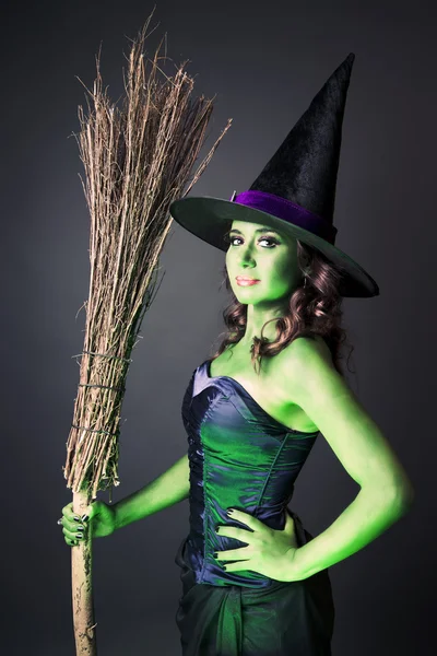 Halloween witch with her broomstick — Stock Photo, Image