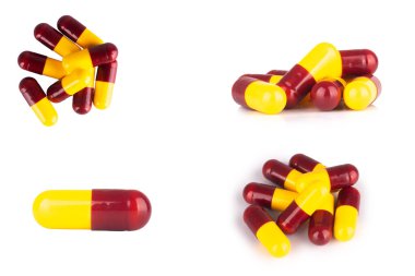 Beyaz arka planda izole kapsül sarı kırmızı tek.