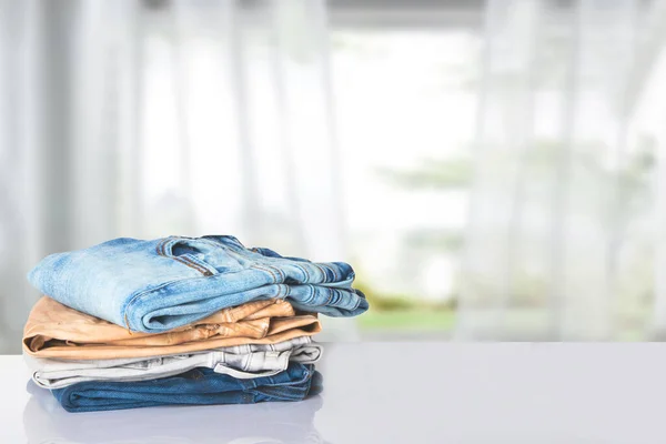 Stack Jeans Closeup Pile Colorful Female Denim Pants Bright Table —  Fotos de Stock