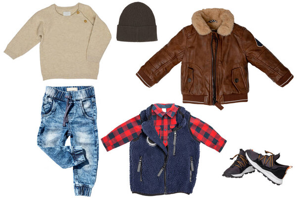 Collage set of little boys spring clothes isolated on a white background. A trendy stylish brown leather jacket, denim trousers or pants, sneaker, vest with shirt and pullover or sweater and hood for child boy. Kids summer fashion.