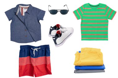 Collage set of children clothes. Denim jeans or pants, shoes, two shirts, glasses, sneaker and shorts for child boy isolated on a white background. Concept spring autumn and summer clothes.