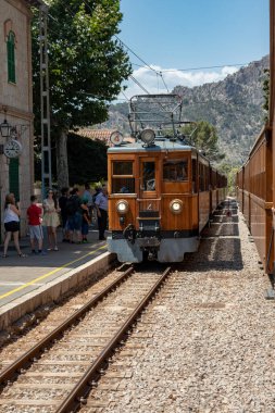 SOLLER, MALLORCA, Spain - JUL 07,2022. Historic electrical vintage wooden train (1912 opened line) from Palma via Bunyola to Soller throught the mountains. Romantic train ride.