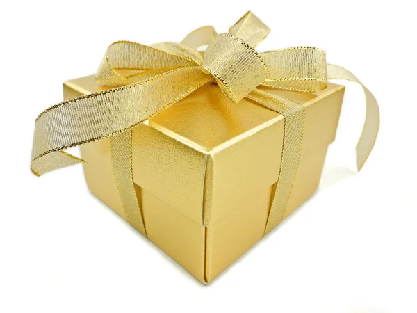 Golden gift box with golden ribbon over white background — Stock Photo, Image