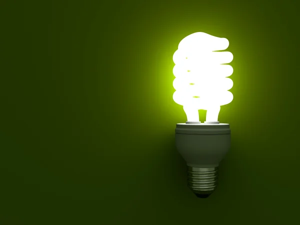 Energiesparende Kompaktleuchtstofflampe leuchtet grün — Stockfoto