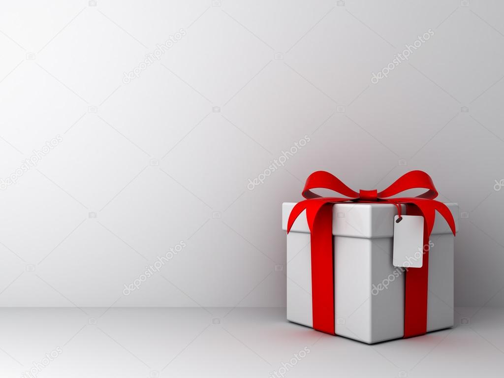 Gift box with red ribbon bow and blank tag on empty white wall background