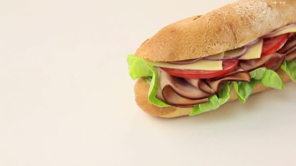 Giant ham, tomato, lettuce, cheese and onion sub ready to serve — Stock Video