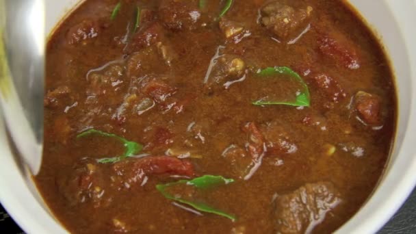 Spooning Indian Curry — Stock Video