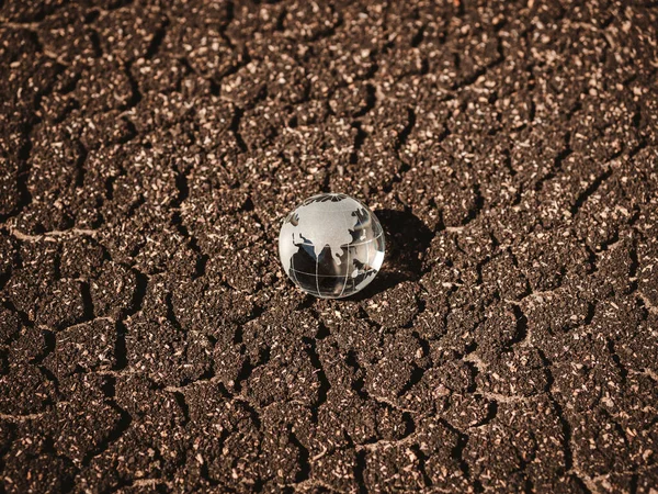 Glass Globe Brown Dried Crack Soil Land Background Top View — Stock Photo, Image