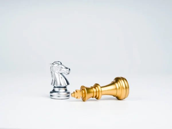 Premium Photo  The golden horse, knight chess piece standing in front of  silver pawn chess pieces on chessboard on dark background. leadership,  follower, team, commander, competition, and business strategy concept.