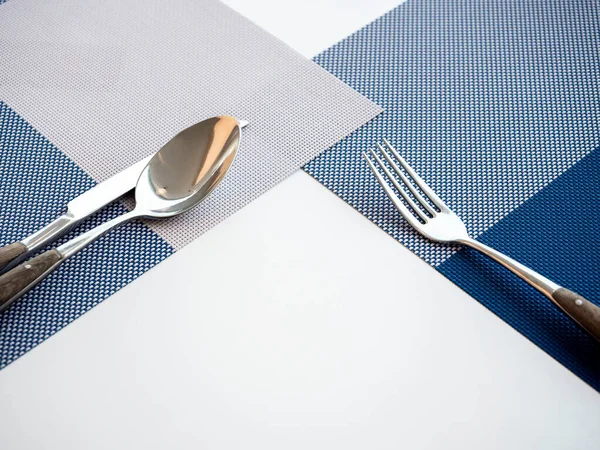 Fork Spoons Knives Empty Space Blue Placemat White Table Guests — Stock Photo, Image