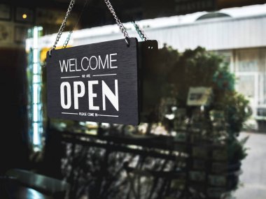 Open sign board with white text on black vintage wooden sign 