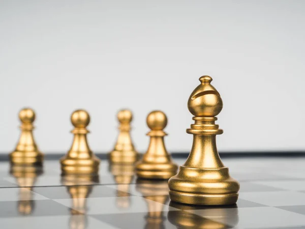 Golden Bishop Chess Piece Front Gold Pawns Chess Board White — Fotografia de Stock