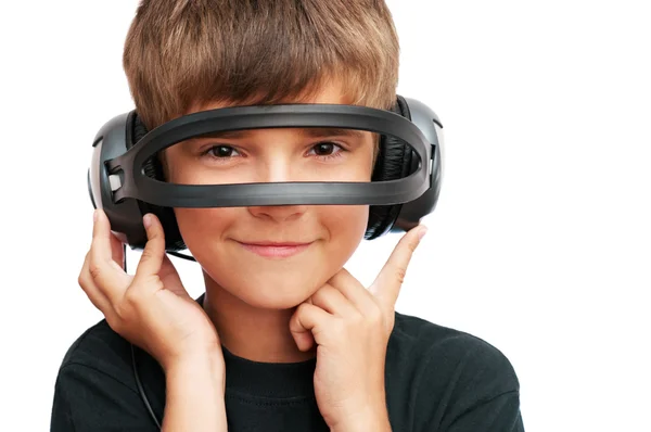 Boy looking through headphones — Stock Photo, Image