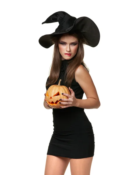 Pretty young brunette woman with a pumpkin — Stock Photo, Image