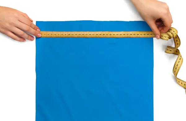 Measures the size of a piece cloth — Stock Photo, Image