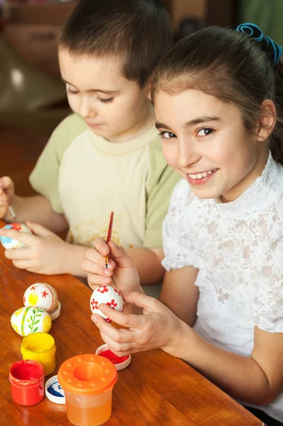 Brother and sister painted Easter eggs — Stock Photo, Image