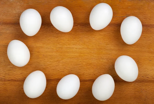 Eggs on a wooden table — Stock Photo, Image