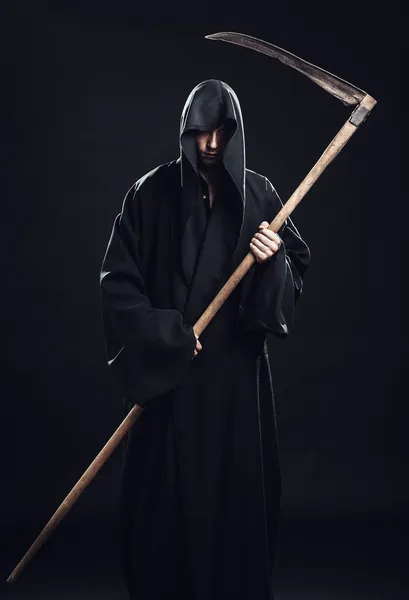 Death with scythe standing in the dark — Stock Photo, Image
