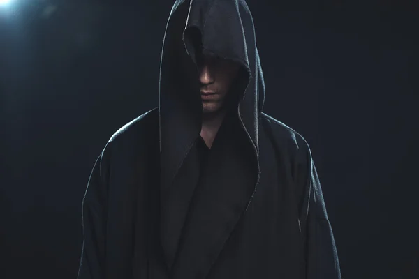 Portrait of man in a black robe — Stock Photo, Image