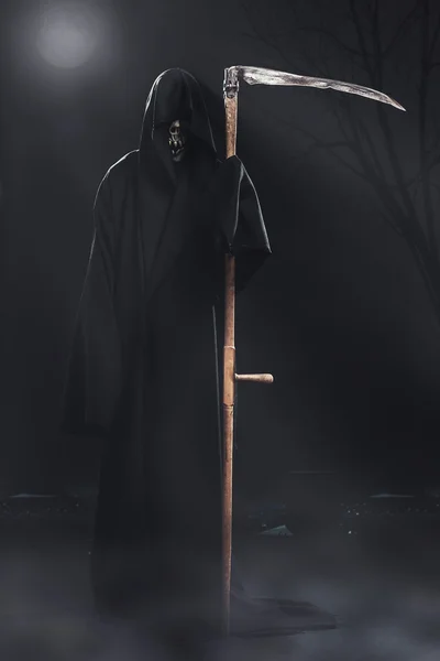 Death with scythe standing at night — Stock Photo, Image