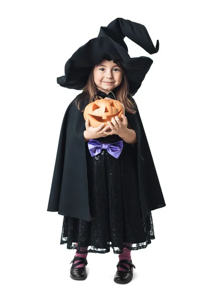 Pequeña bruja con calabaza sobre un fondo blanco —  Fotos de Stock