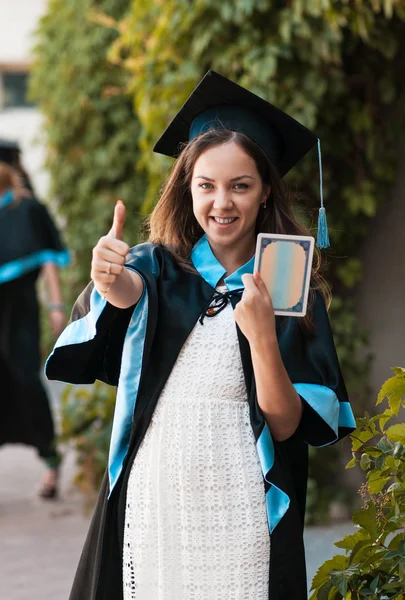 University graduate with a diploma — Stock Photo, Image