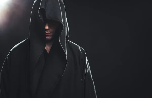 Portrait of man in a black robe — Stock Photo, Image